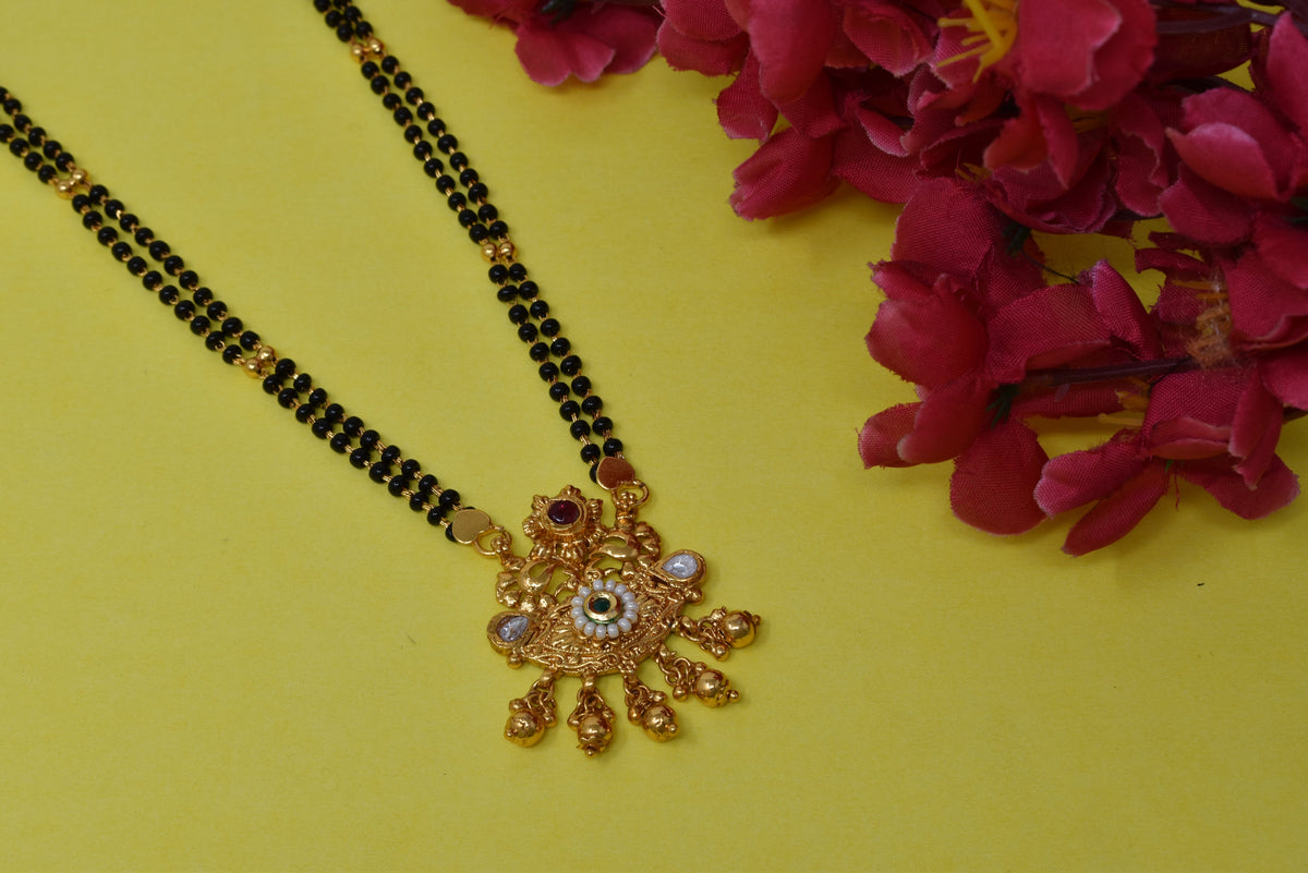 Golden and black beads chain with pendal